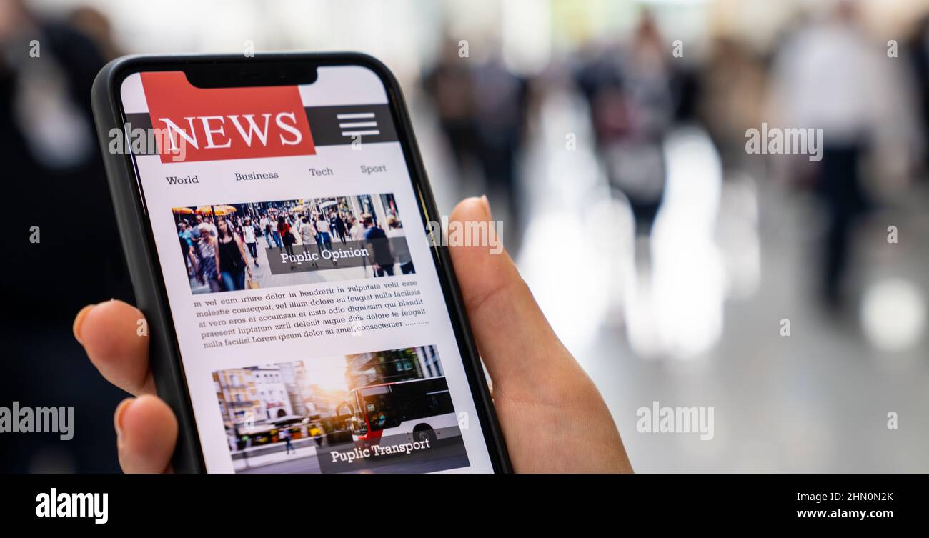 Online news on a mobile smartphone. Close up of businesswoman reading news or articles in a smartphone screen application. Hand holding smart device. Stock Photo