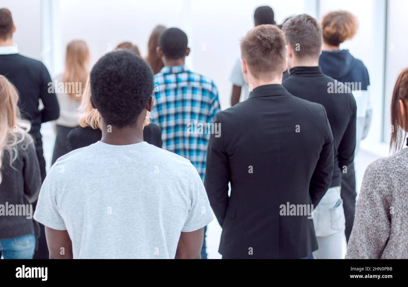 group of diverse young people standing in the office lobby Stock Photo ...