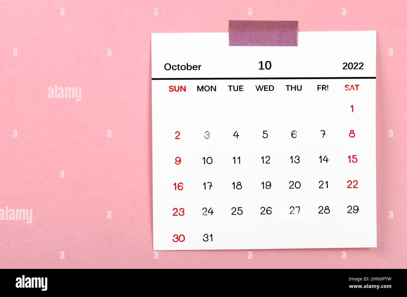 The October 2022 calendar on pink background. Stock Photo
