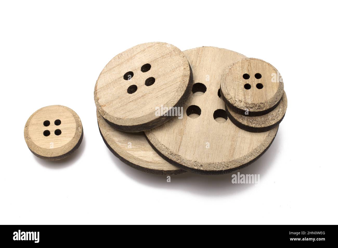 Close up of stack of different size wooden discs cut out from wood