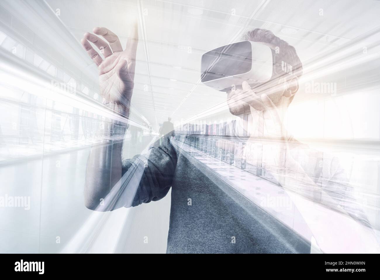 young man using a virtual reality headset - futuristic concept image Stock Photo