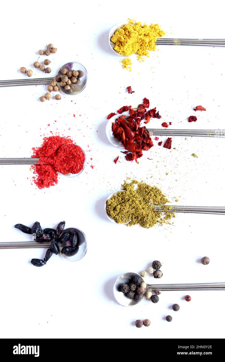 set of assorted colorful spices on a white background, flat lay, top view, with copy spice. Stock Photo