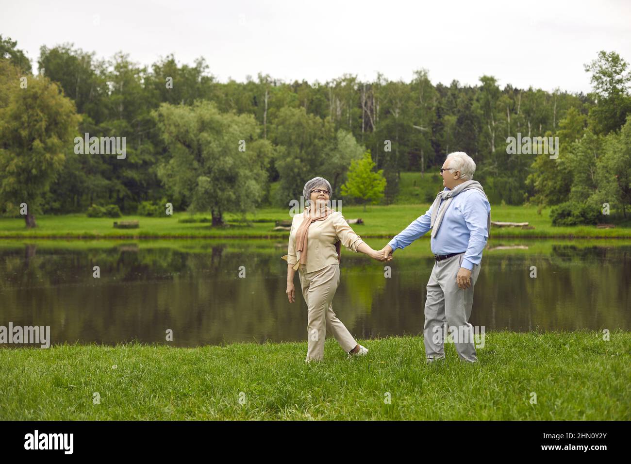 Happy man woman holding hands hi-res stock photography and images - Alamy