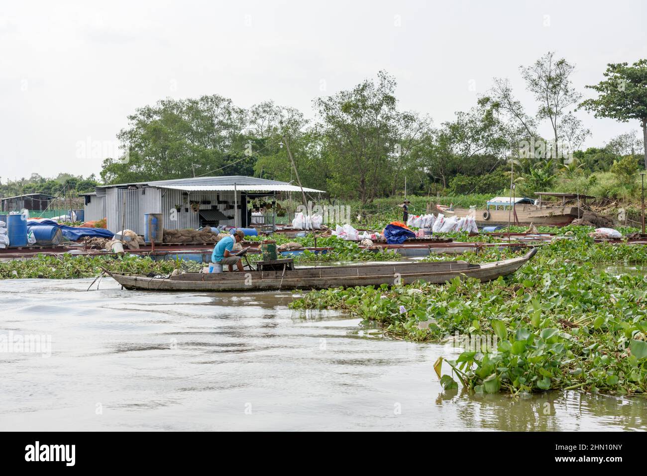 Floating house at a floating village on the Mekong River, Mekong Delta