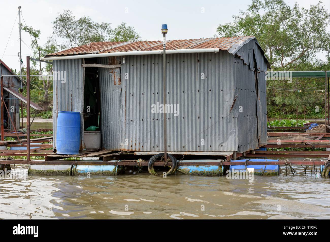 Floating house at a floating village on the Mekong River, Mekong Delta