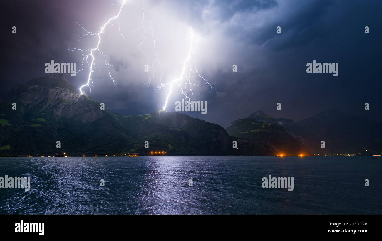 Mountain landscape by storm and rain. Discharge of lightning strikes ...