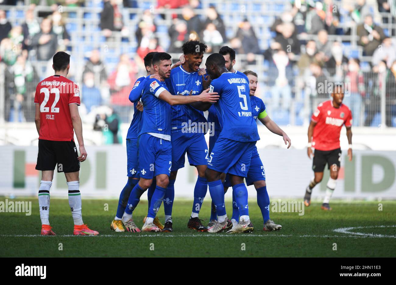 Hanover, Germany. 13th Feb, 2022. Soccer: 2nd Bundesliga, Matchday 22: Hannover  96 - SV Darmstadt 98 at the HDI Arena. Darmstadt's Aaron Seydel (center)  celebrates with his teammates after scoring the 2:2.