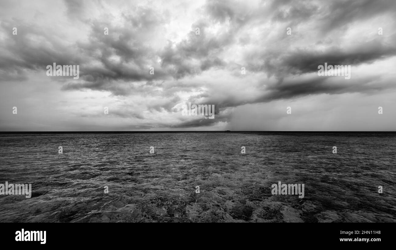 Storm clouds over the ocean. Tropics. Maldives in black and white Stock ...
