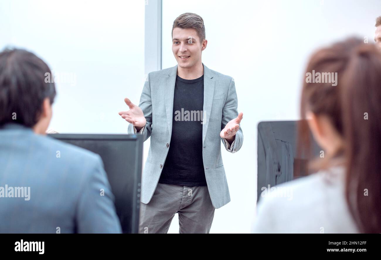 young businessman explaining something to the office staff Stock Photo ...