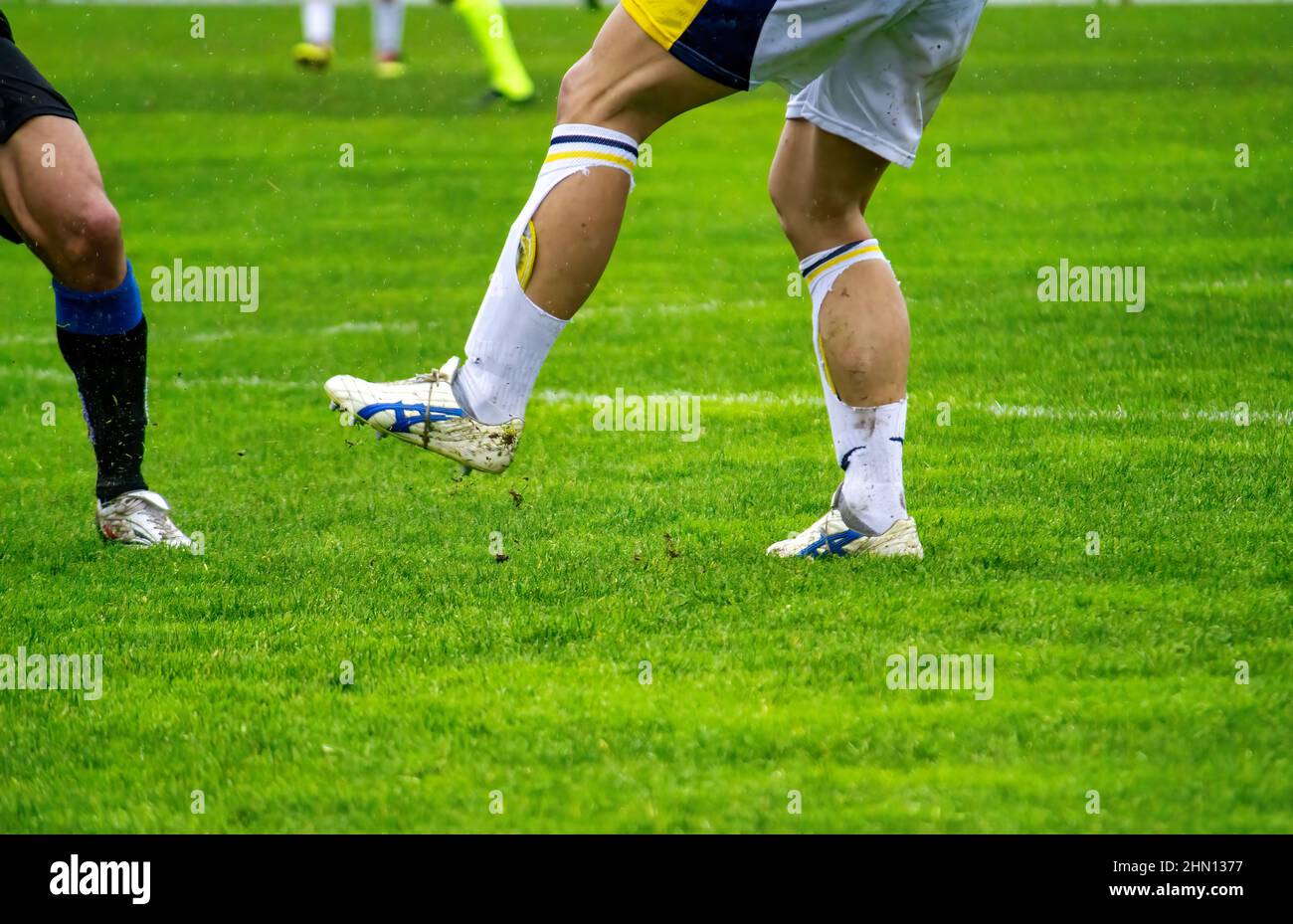Legs of soccer players in action on a soccer field Stock Photo Alamy
