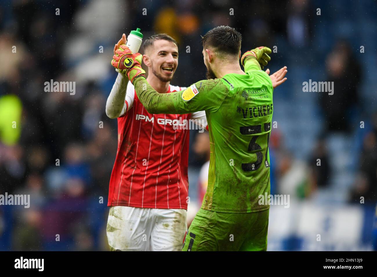 Josh Vickers #31 of Rotherham United celebrates with Dan Barlaser #4 of ...