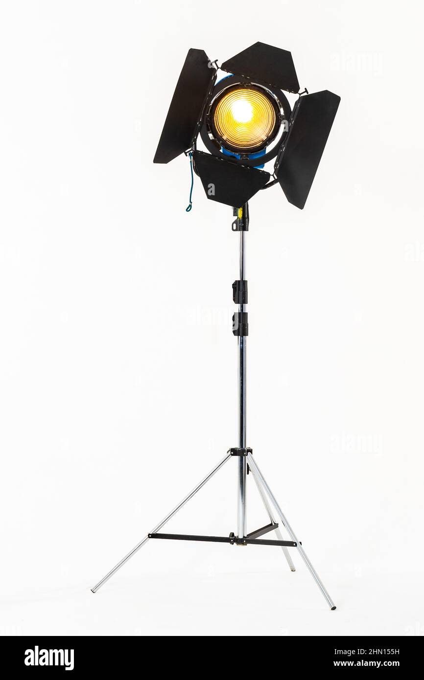 Film warm lighting, stage light with barndoors on a stand isolated on a