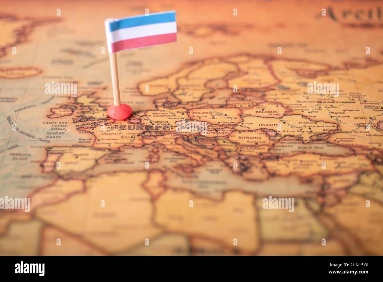 The flag of Luxembourg on the world map. The concept of travel and tourism. Stock Photo