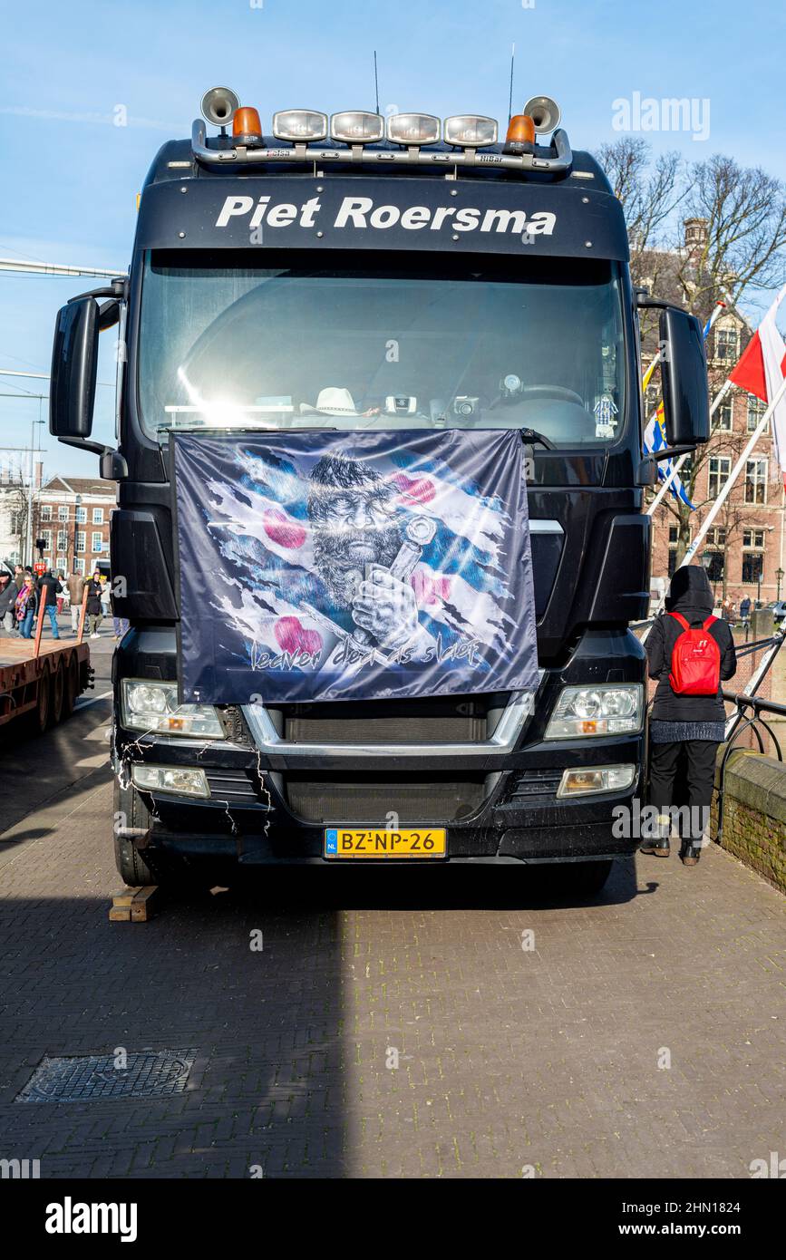 The Hague, Netherlands. On February 13, 2022 the Dutch Freedom Convoy / Convoy for Freedom blocked down town The Hague near Binnenhof, the Political Center of the country. The Battle for Freedom, an end to Corona Measures, respect for the Constitution and, in general, a reopening of societey. After several hours they were forced by Police to leave for the ADO Football Soccer Stadium. ConvoyForFreedom2022. #ConvoyForFreedom2022 Stock Photo
