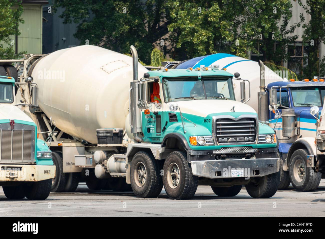 cement mixer trucks at cement works on Granville island Vancouver British Columbia canada Stock Photo