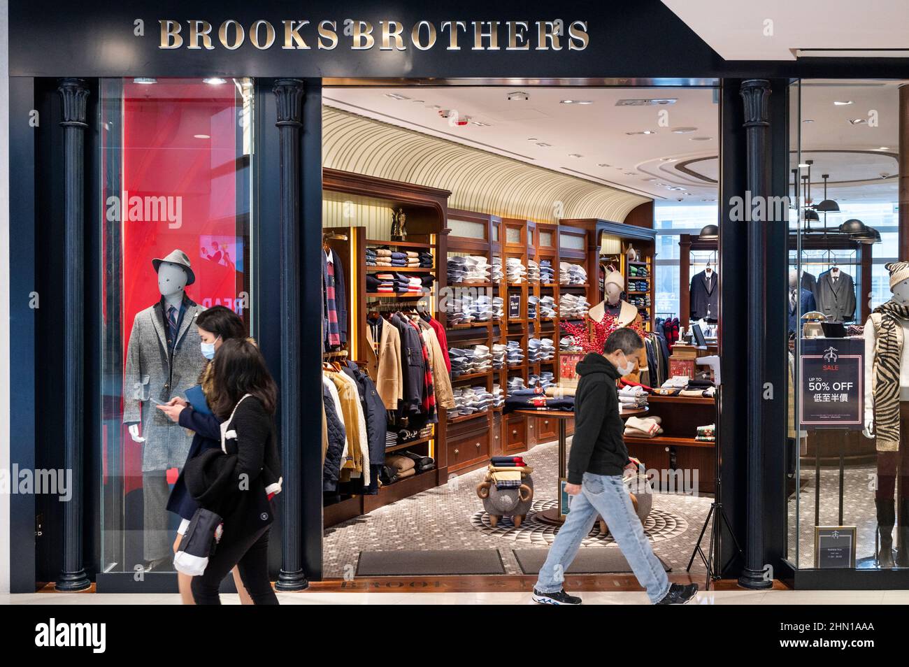 Shoppers walk past the American clothing brand for men, Brooks Brothers,  store in Hong Kong. (Photo by Budrul Chukrut / SOPA Images/Sipa USA Stock  Photo - Alamy