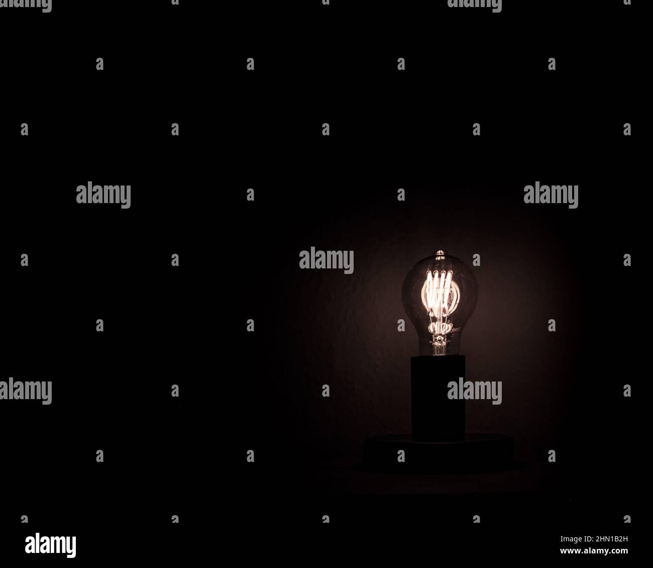 light bulb moment as still life with industrial design lamp Stock Photo