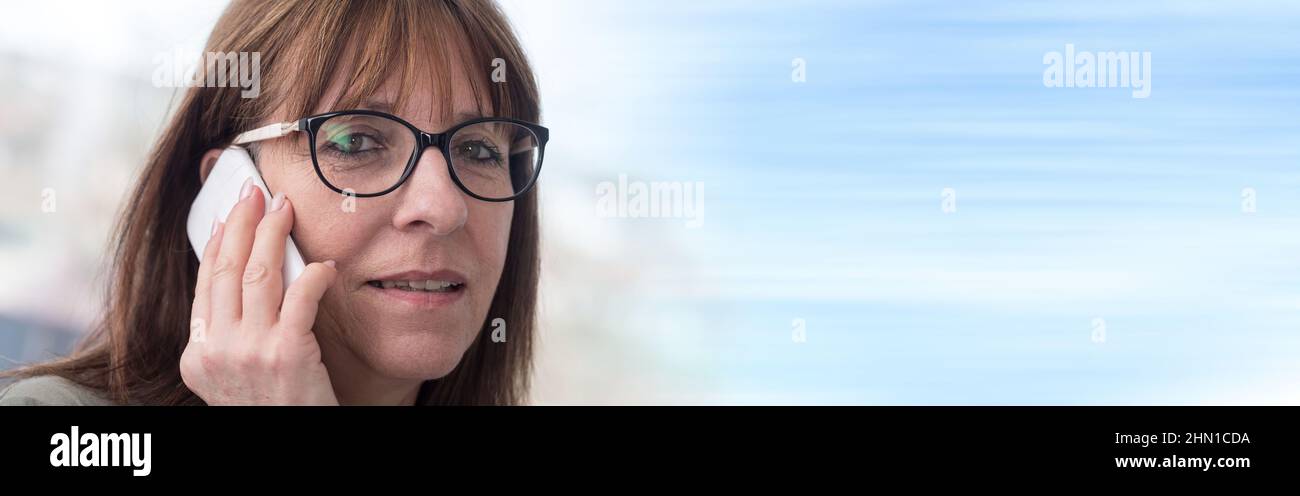 Mature woman talking on mobile phone Stock Photo - Alamy