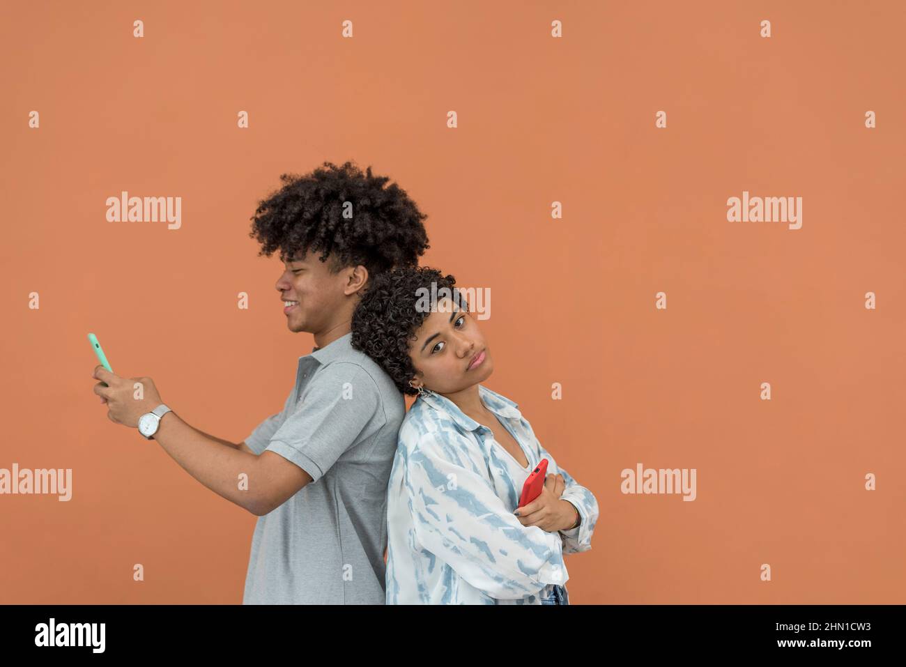 African American latin couple using smartphone,Panama, Central America Stock Photo
