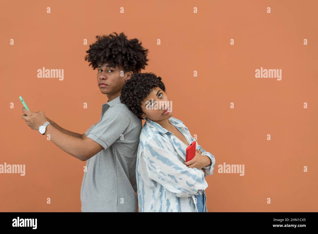 African American latin couple using smartphone,Panama, Central America Stock Photo