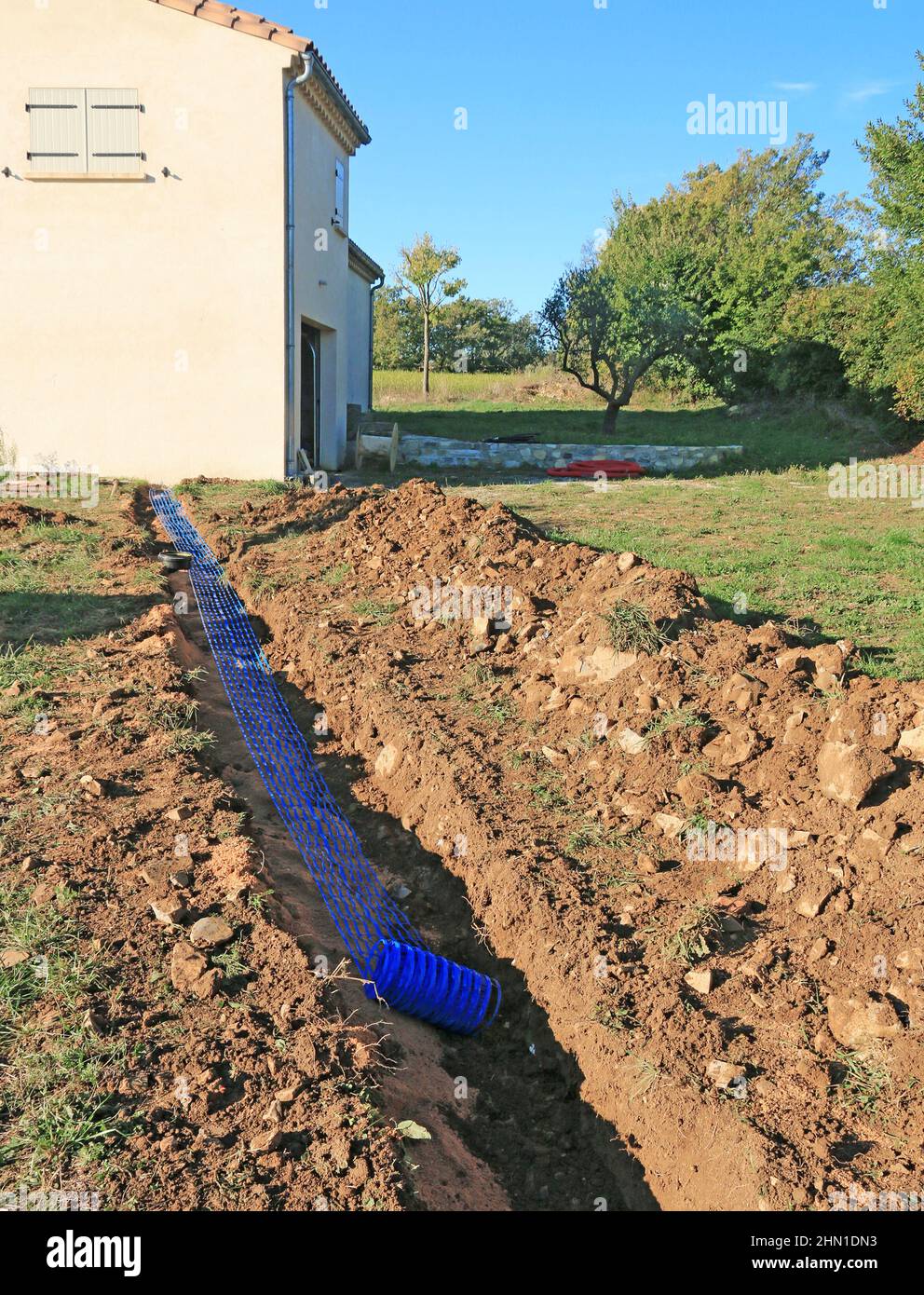 Trench for connection to the network of an individual house. Stock Photo