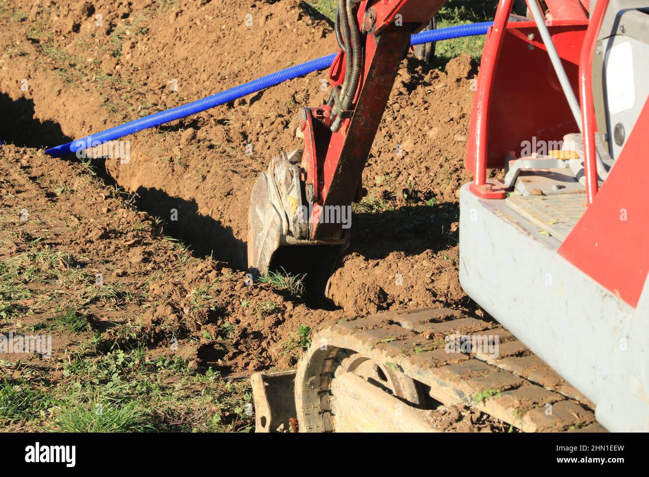 Laying pipes in the connecting trench of a house. Stock Photo