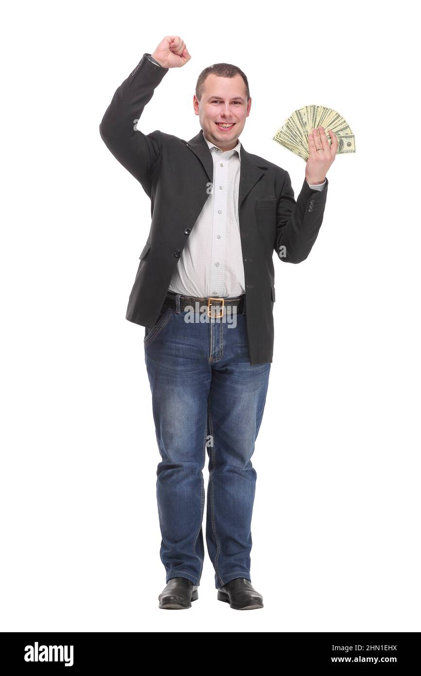Happy young man holding money while standing and arm up Stock Photo