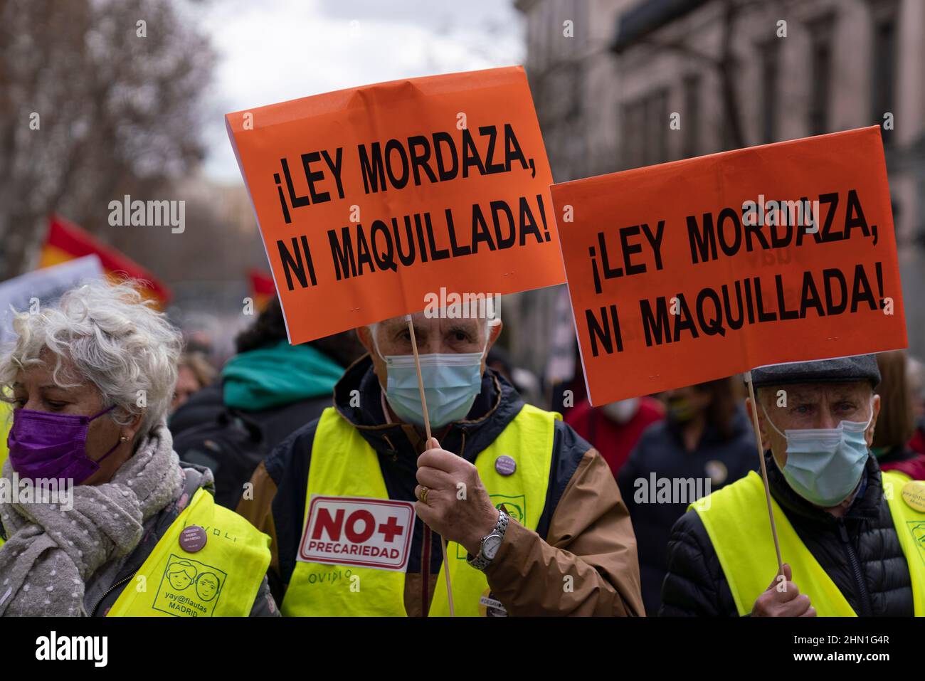 Madrid, Spain. 13th Feb, 2022. Demonstrators holding placards with the slogan of the protest 'neither gag law nor make-up gag' during a protest against the controversial security law known as 'Gag Law' in Madrid. (Photo by Guillermo Gutierrez Carrascal/SOPA Images/Sipa USA) Credit: Sipa USA/Alamy Live News Stock Photo