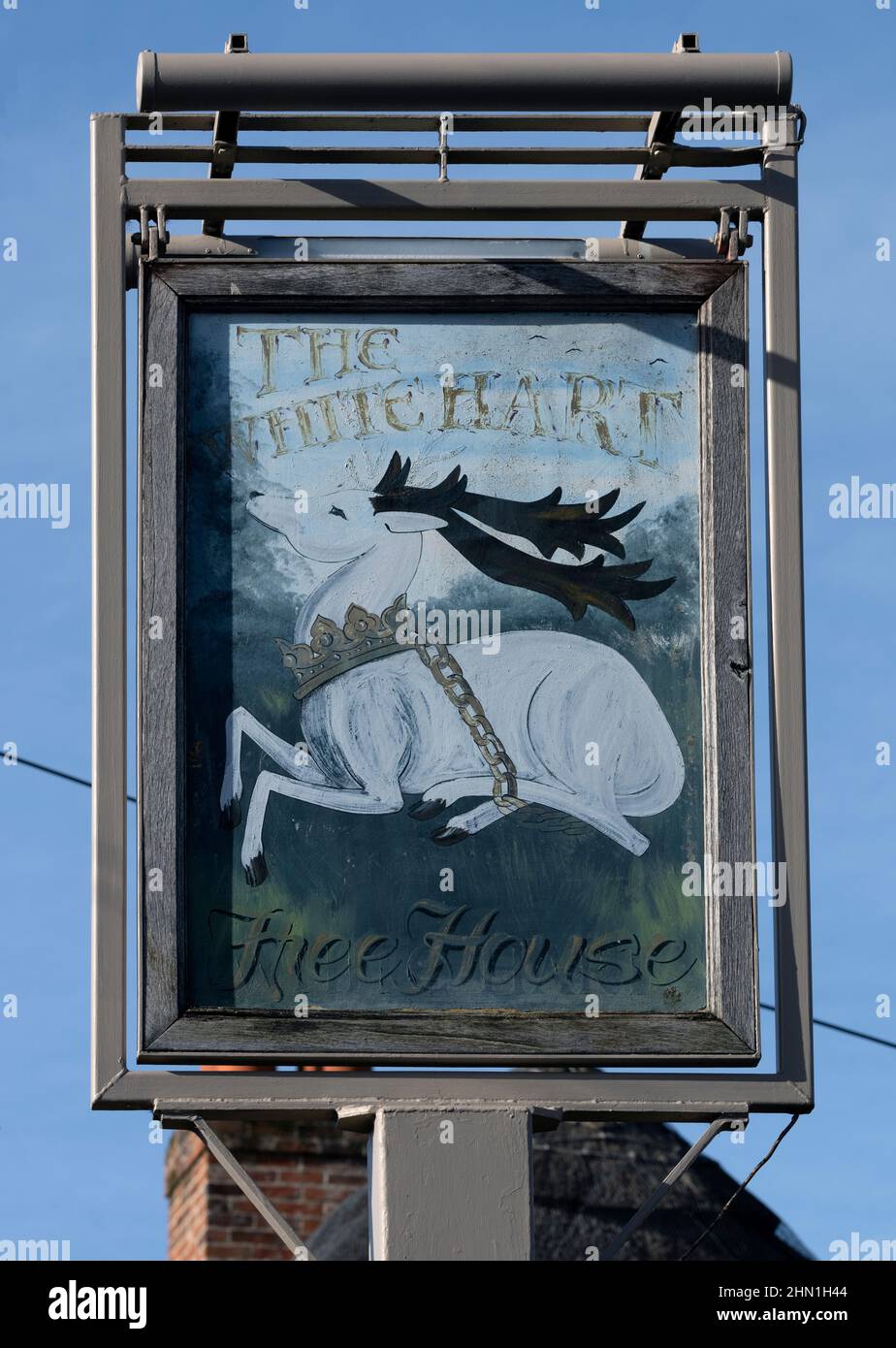 Traditional hanging pub sign at The White Hart - public house - Over Wallop, Stockbridge, Hampshire, England, UK Stock Photo