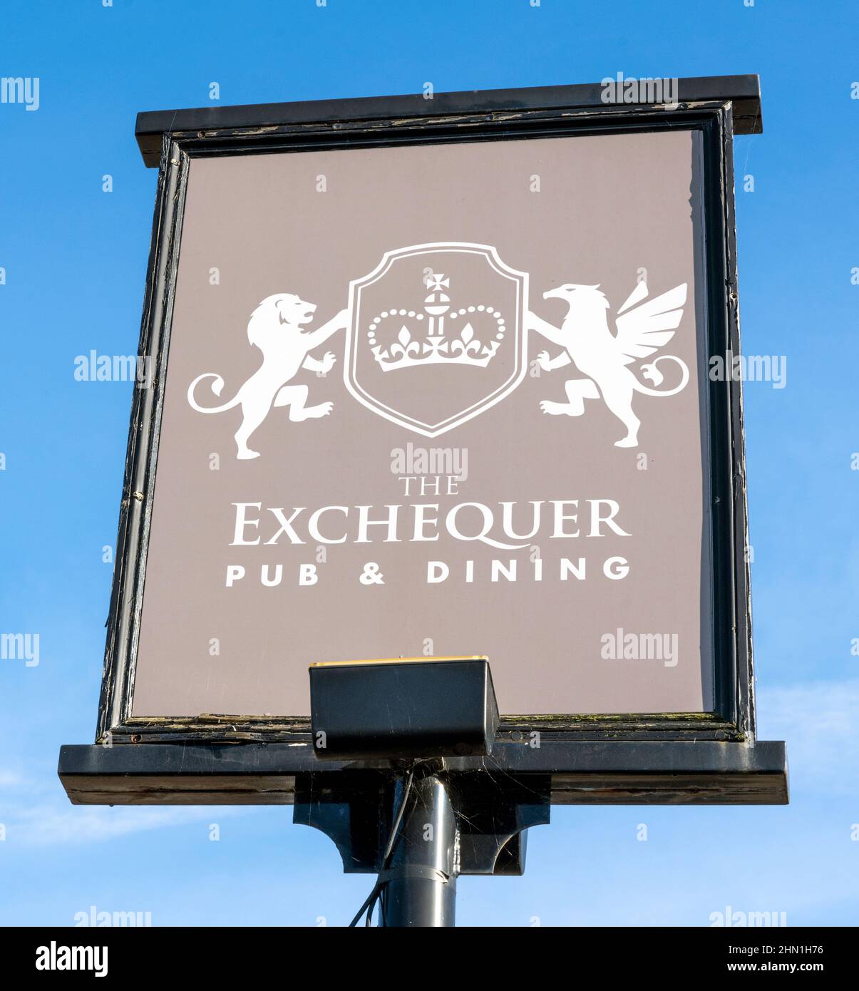 Traditional hanging pub sign at The Exchequer - public house - Crookham Village, Fleet, Hampshire, England, UK Stock Photo