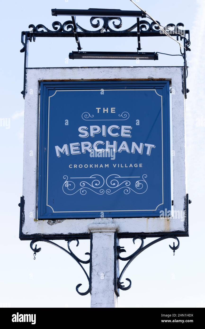 Traditional Hanging pub sign at The Spice Merchant - public house - Crookham, Fleet, Hampshire, England, UK Stock Photo
