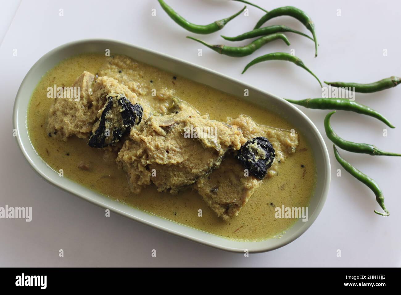 Kerala style, coconut based Pomfret fish curry. Yellow coloured fish