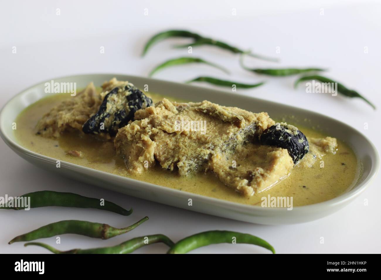 Kerala style, coconut based Pomfret fish curry. Yellow coloured fish