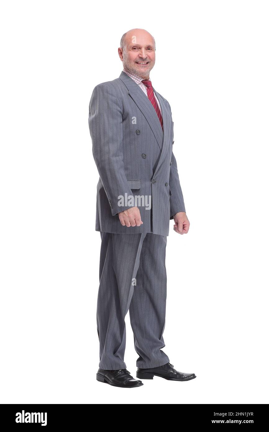 Full length profile portrait of businessman in suit looking at camera Stock Photo