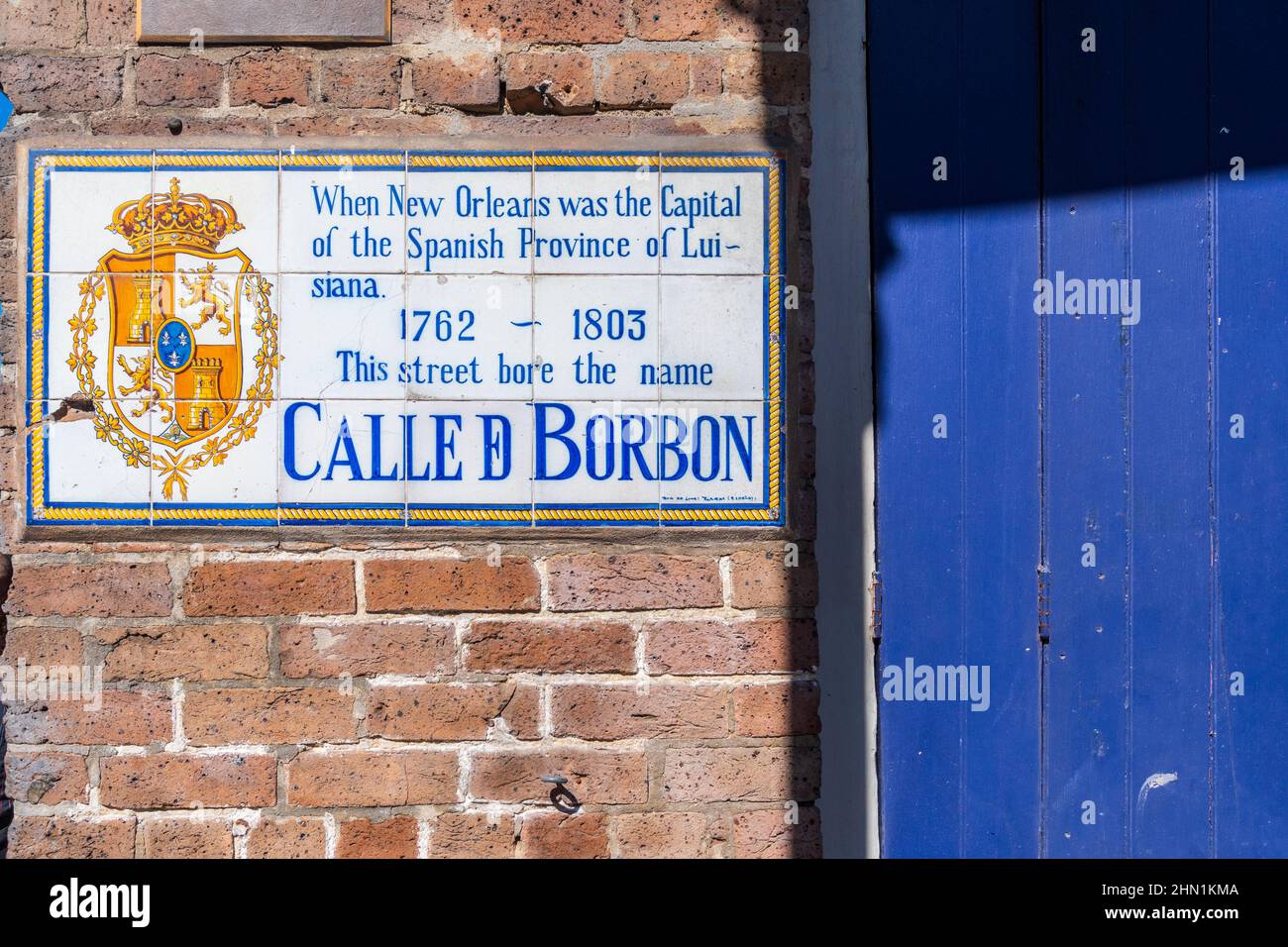 Bourbon Street sign and blue door in the New Orleans French Quarter, Louisiana, USA. Stock Photo