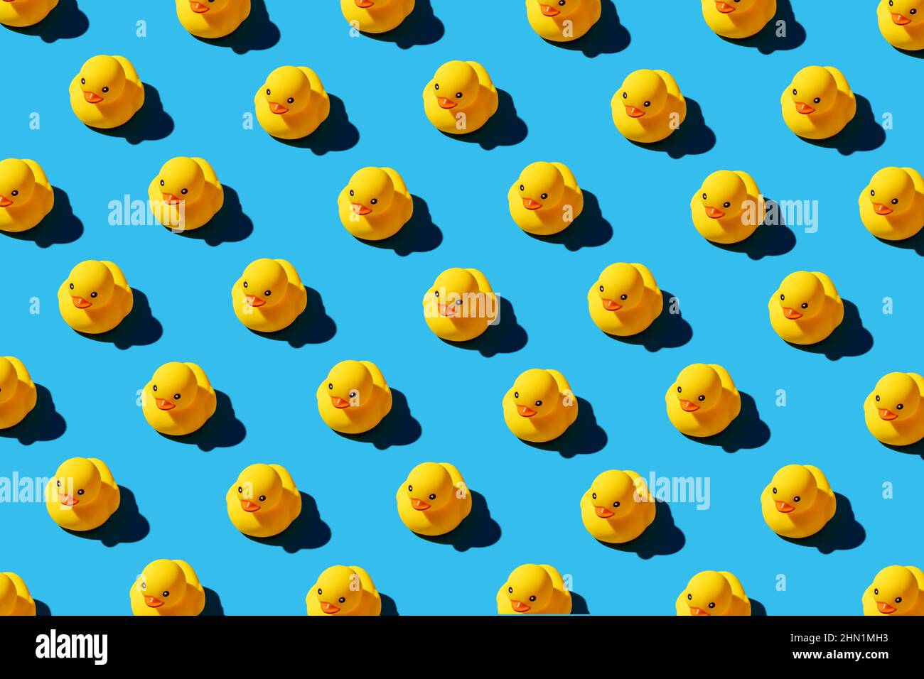 Yellow rubber duck toys pattern on seamless blue background. Bright ...
