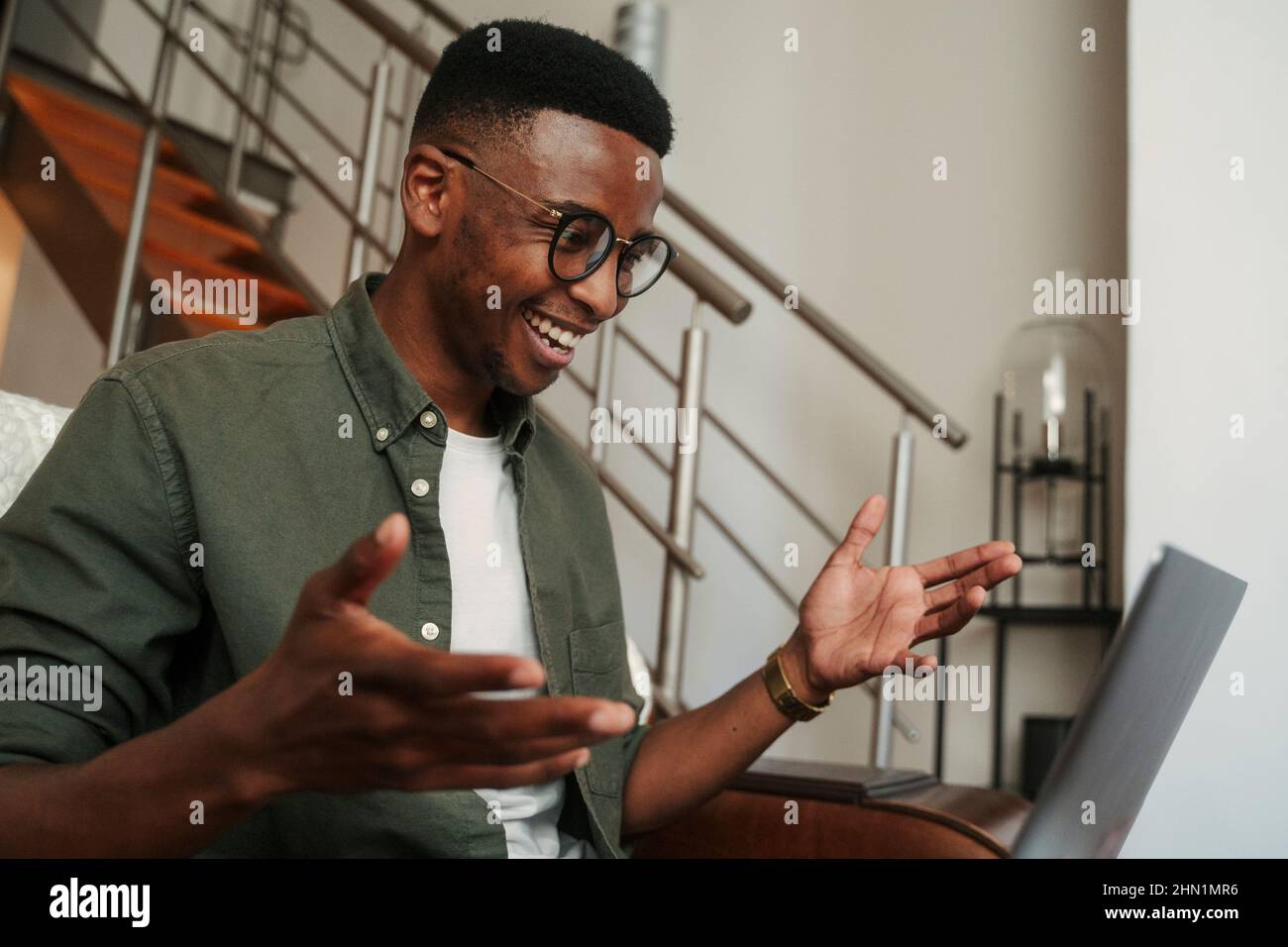 African American male video calling on laptop Stock Photo - Alamy