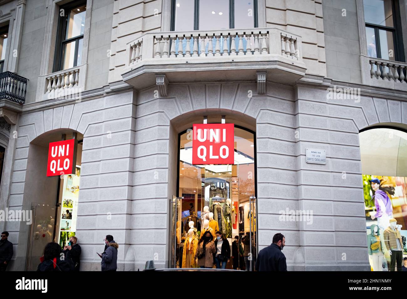 People passes by a Uniqlo clothing and apparel store in the city downtown  in Barcelona, Spain on February 12, 2022. (Photo by Davide Bonaldo/Sipa USA  Stock Photo - Alamy