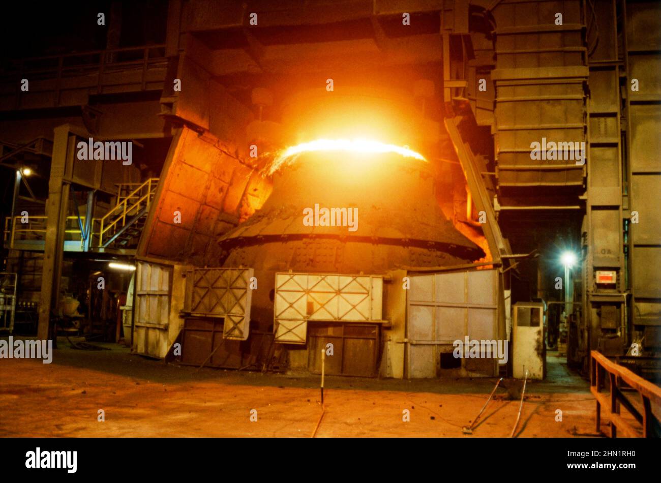 A mid-1980s view inside the Port Talbot Steelworks, an integrated steel production plant in Port Talbot, West Glamorgan, Wales, UK. Here one of the giant furnaces is powered by coal. This image is from a vintage colour transparency taken by a visiting photographer – a vintage 1980s photograph. Stock Photo