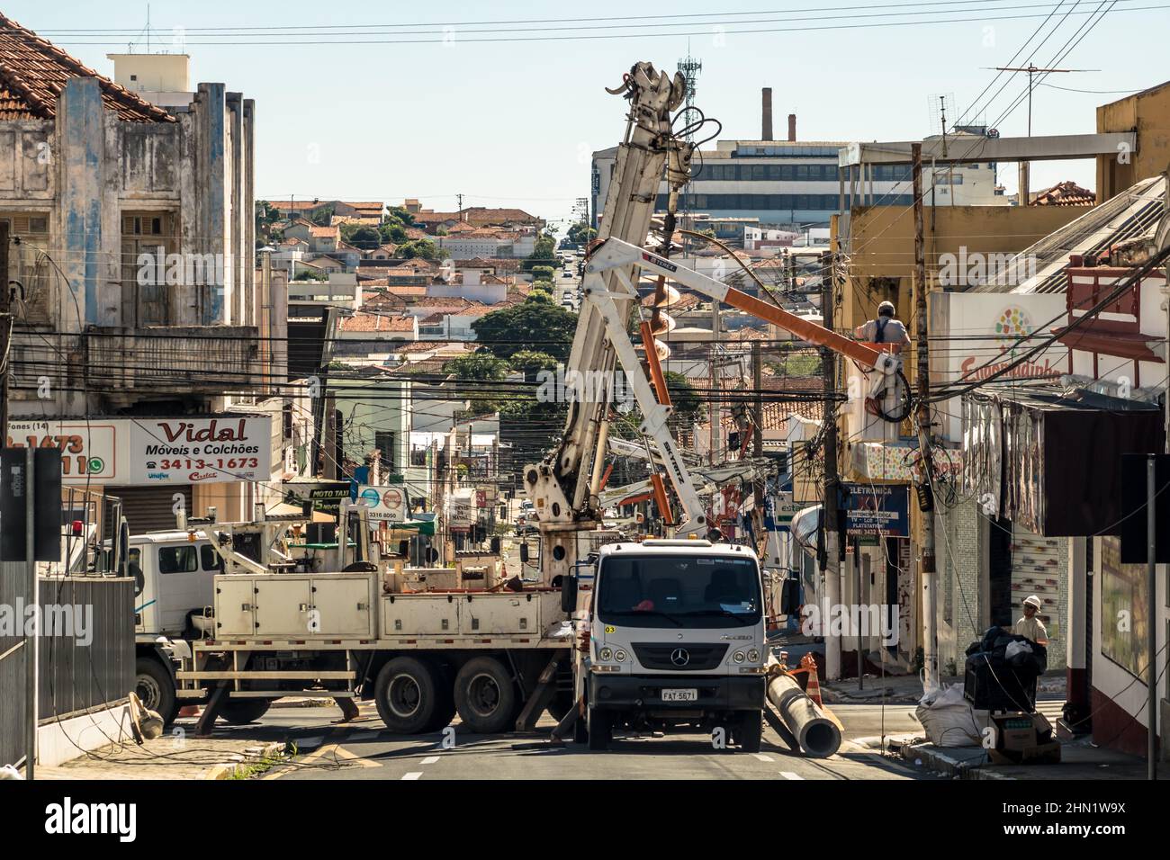 Marília, São Paulo, Brazil, May 26, 2019 Workers change poles and maintain the power grid on a street in downtown Marília. Stock Photo
