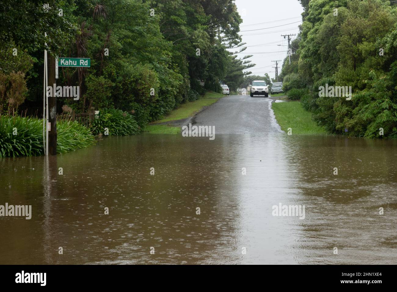 Flooded road blocks road after torrential rain in Kapiti, New Zealand Stock Photo