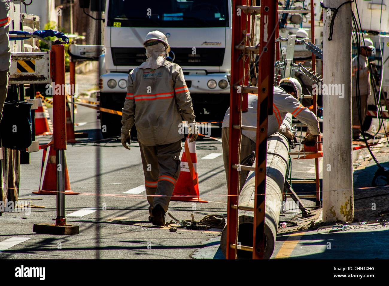 Marília, São Paulo, Brazil, May 26, 2019 Workers change poles and maintain the power grid on a street in downtown Marília. Stock Photo