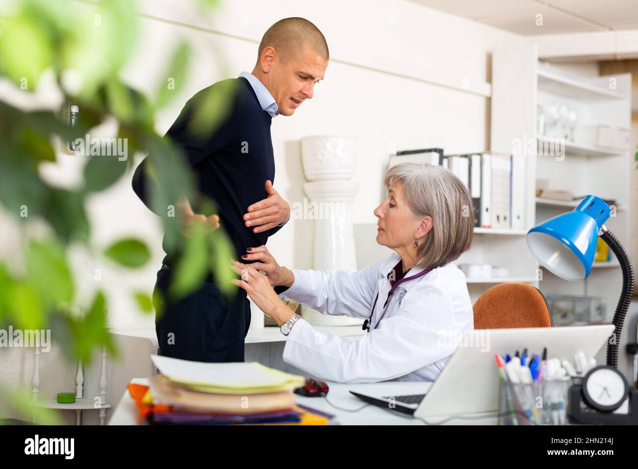 Doctor palpating the stomach hires stock photography and images Alamy