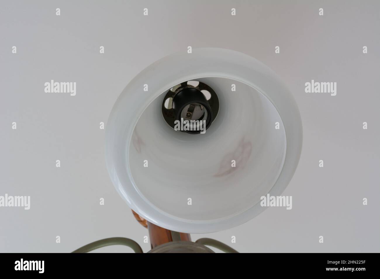 Chandelier shade. Broken ceiling chandelier without light bulb Stock