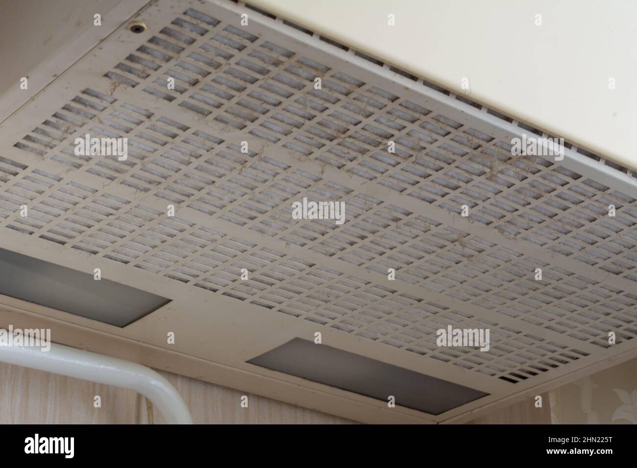 Dirty kitchen hood over the stove. Dirty range hood over the cooking oven Stock Photo