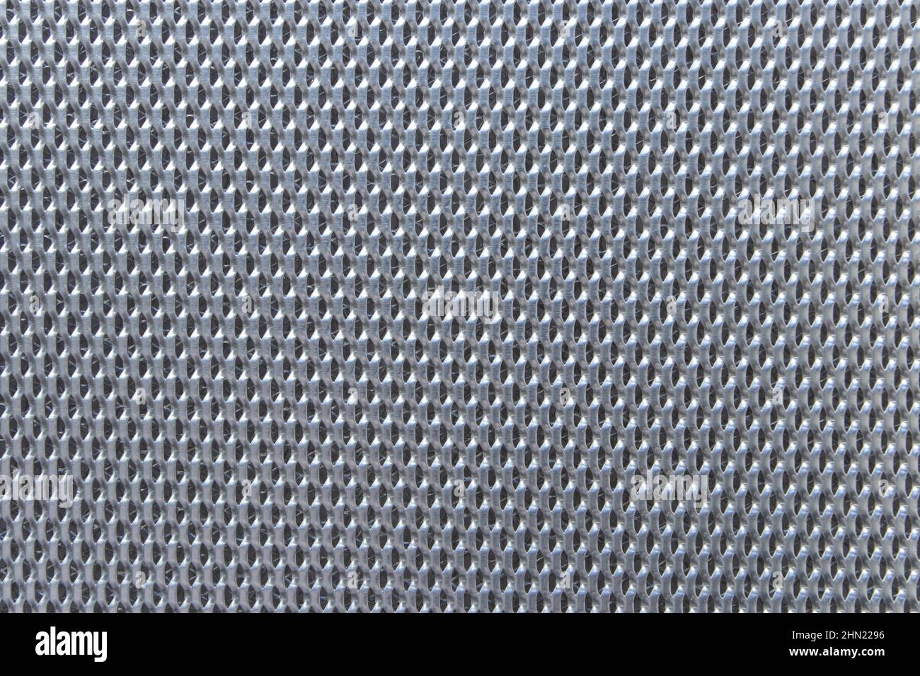 Shiny metallic contemporary hitech background. Decorative metal mesh. Stock Photo