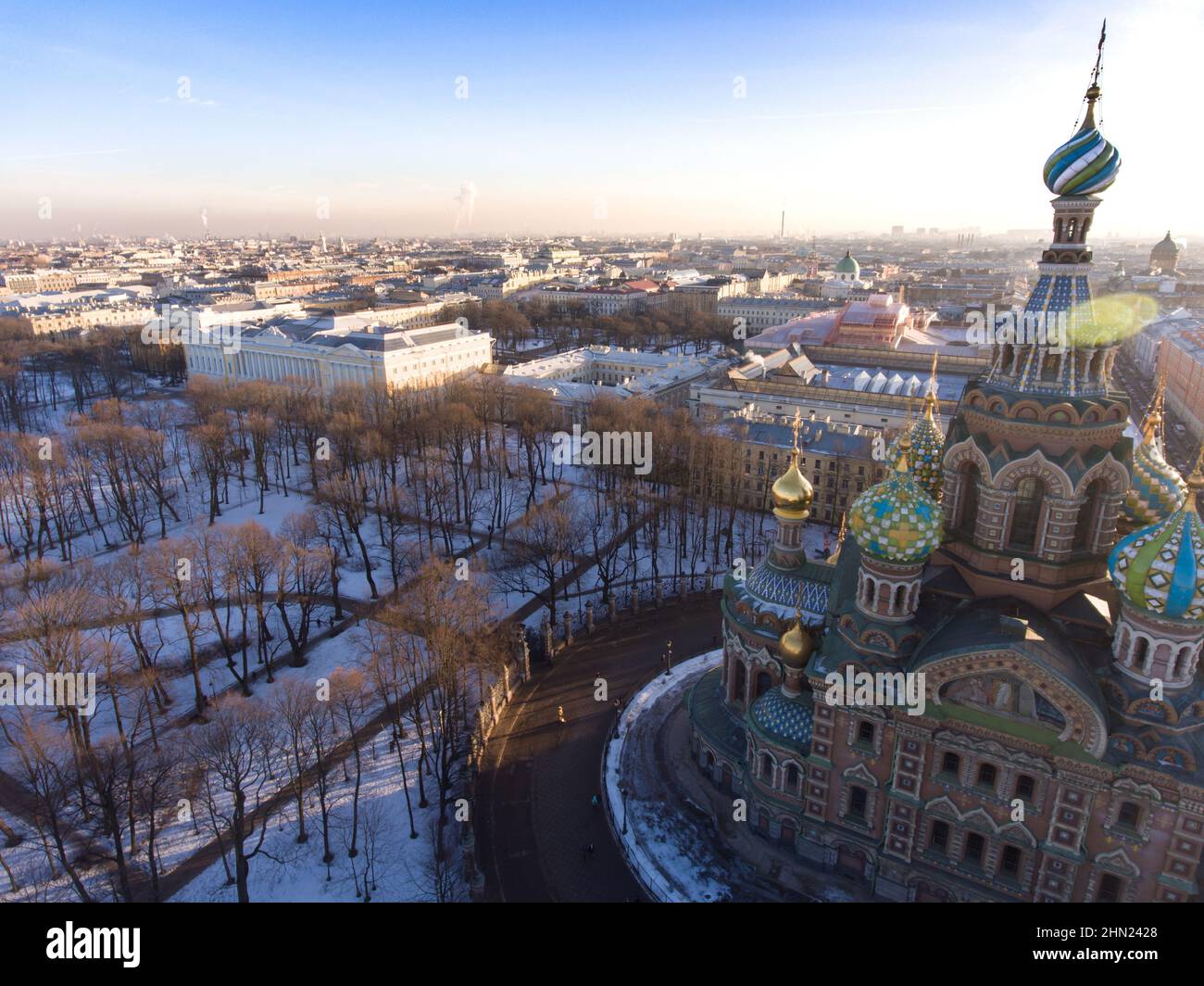 Russia, Saint-Petersburg, Aerial view of the cathedral Church of the Savior on Blood and Russian Museum of Arts at sunset, golden domes, roofs, winter Stock Photo
