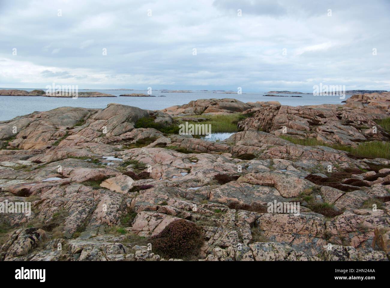 Landscape with ocean and red granite boulders at Stångehuvud nature ...