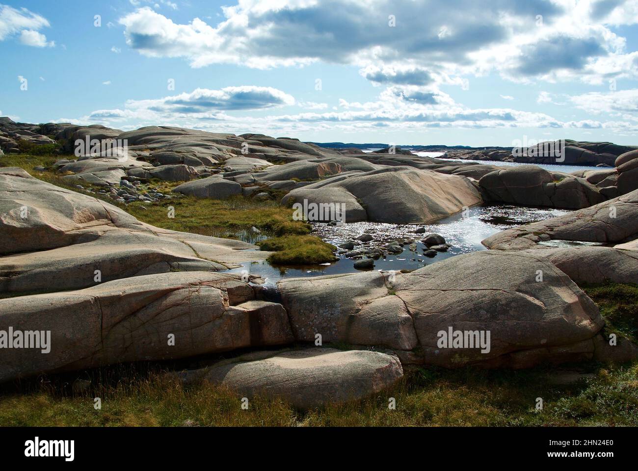 Landscape with ocean and red granite boulders at Stångehuvud nature ...