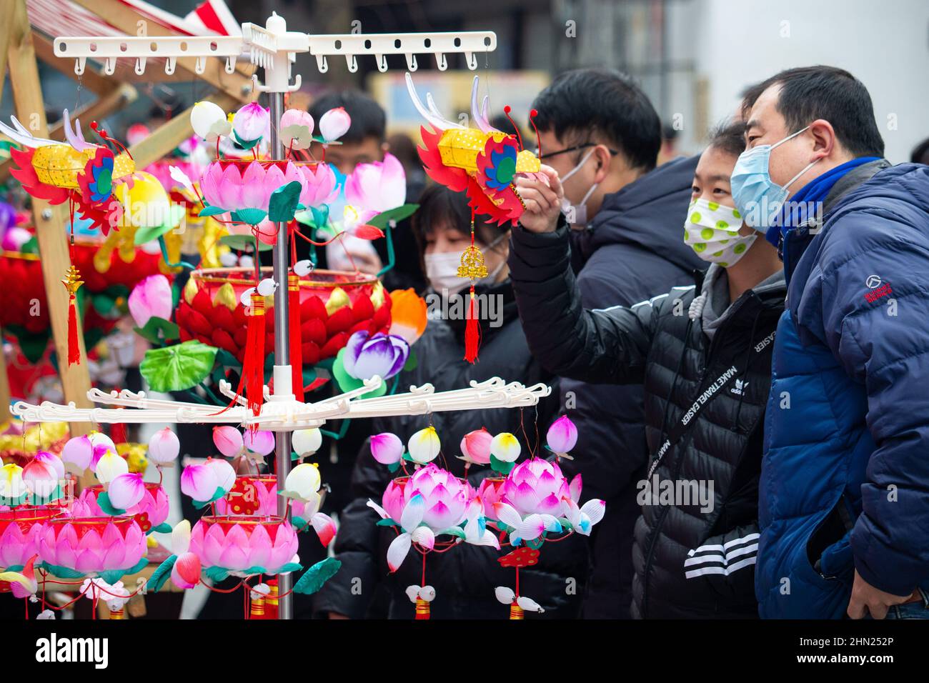Nanjing, China's Jiangsu Province. 13th Feb, 2022. People select lanterns at Fuzi (Confucius) Temple scenic area in Nanjing, east China's Jiangsu Province, Feb. 13, 2022. Various events are held across China to celebrate the upcoming Lantern Festival. Credit: Su Yang/Xinhua/Alamy Live News Stock Photo